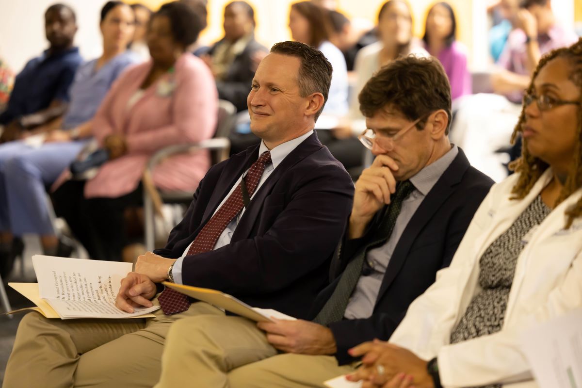 Drs.Mann, Dobbs, and Wallace sitting in audience at the 2023 Honors and Awards Ceremony